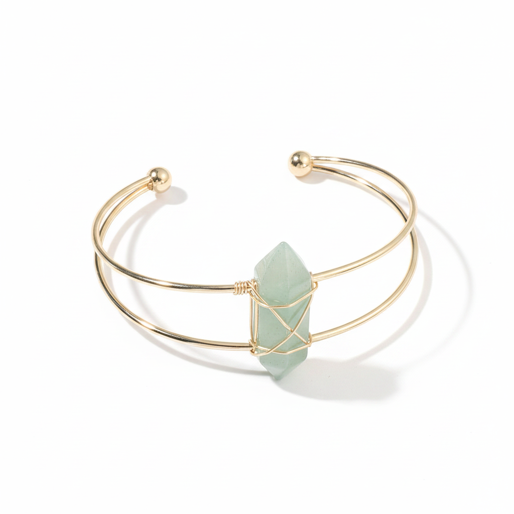 Gold double-wire open cuff bracelet with a pale green faceted stone