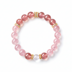 Pink quartz and strawberry crystal bracelet on a white background