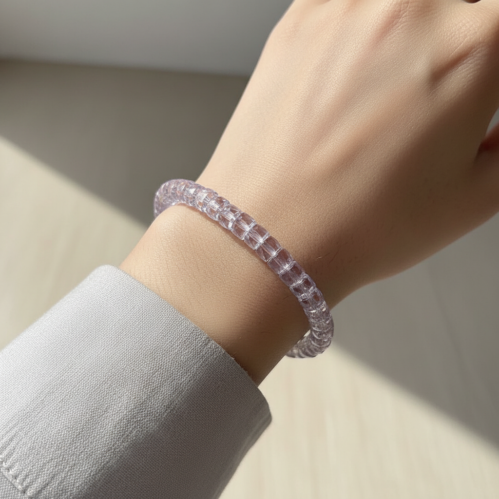 Pale lavender faceted amethyst bracelet worn on a wrist