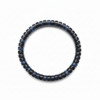 Side view of the blue tiger eye bracelet standing in a small circle showing bead thickness and waves of blue chatoyant light
