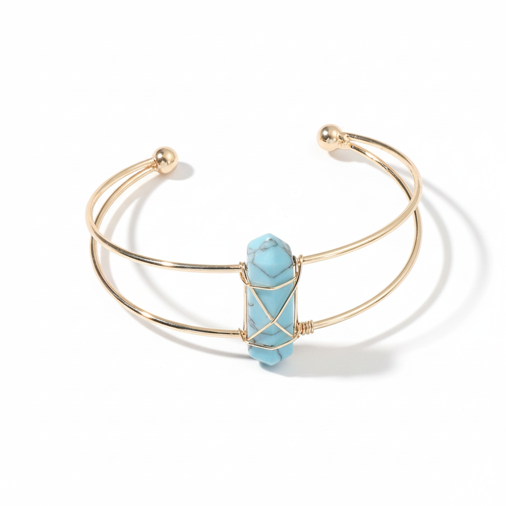 Gold double-wire open cuff bracelet with a pale blue faceted stone