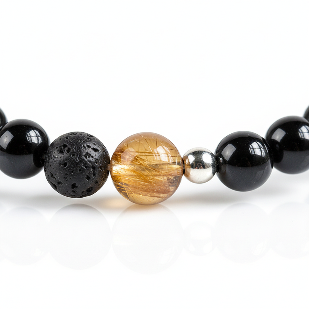 Close-up of textured dark bead translucent golden bead and silver spacer
