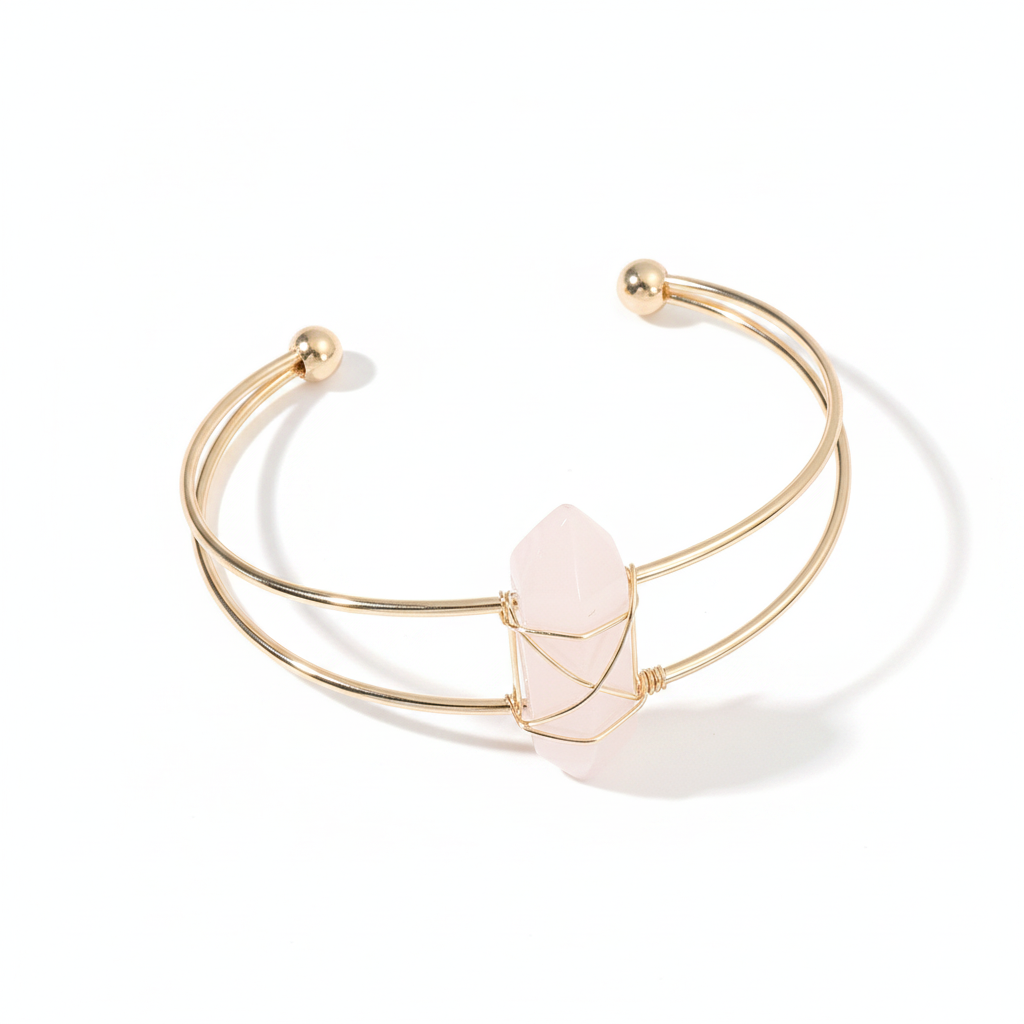 Gold double-wire open cuff bracelet with a pale pink faceted stone